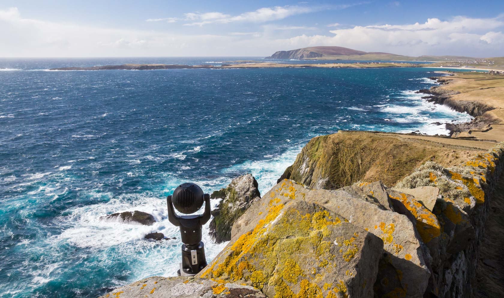 Wide view of Sumburgh Head cliffs under a Shetland sky